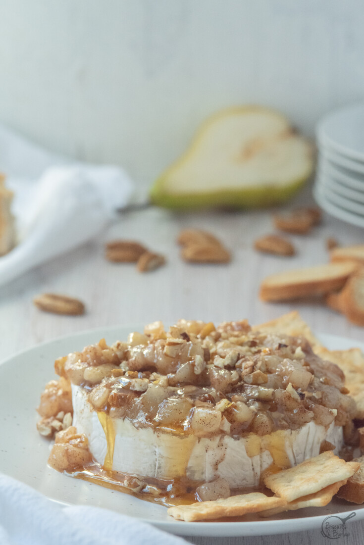 camembert cheese topped with honey, pecans & pears