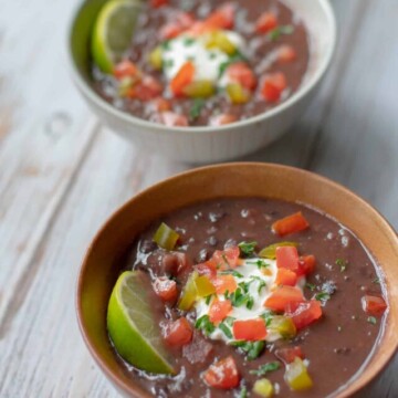 three bowls of black bean and ham soup