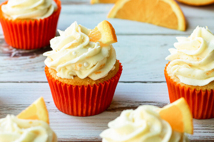 several orange cupcakes