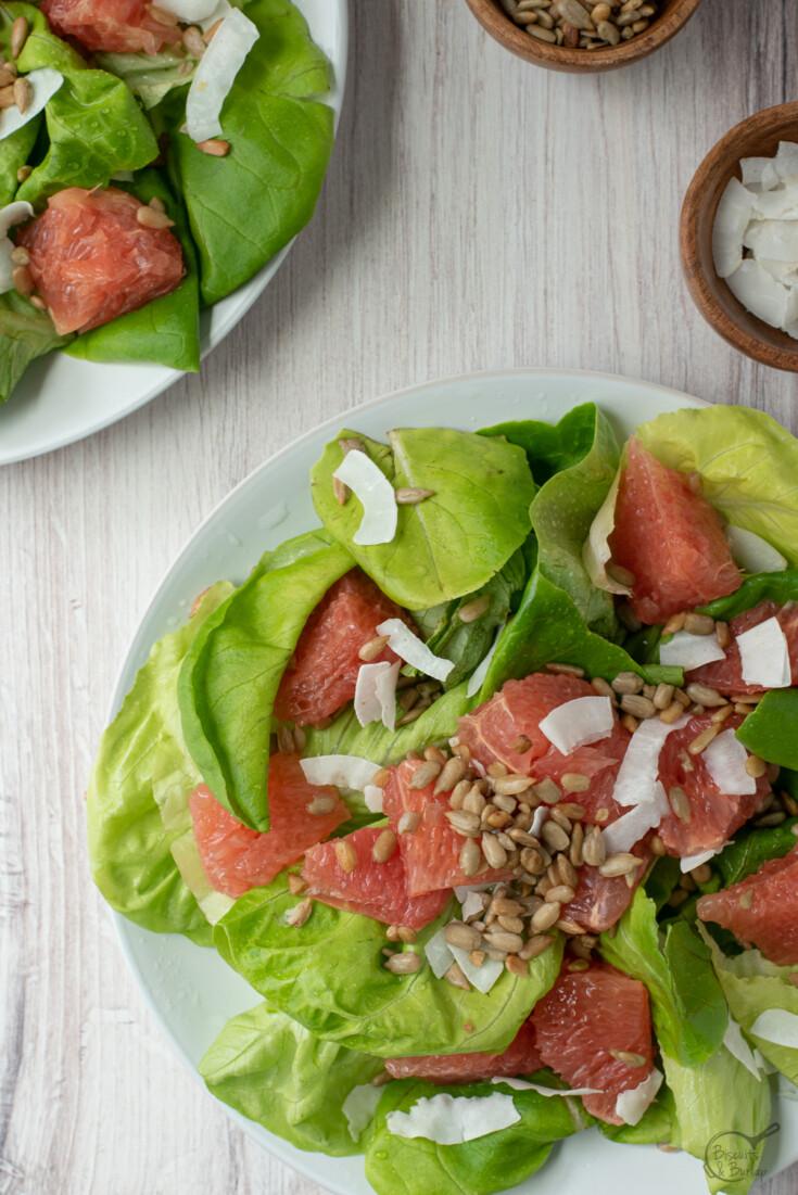 overhead shot of two salads with grapefruit