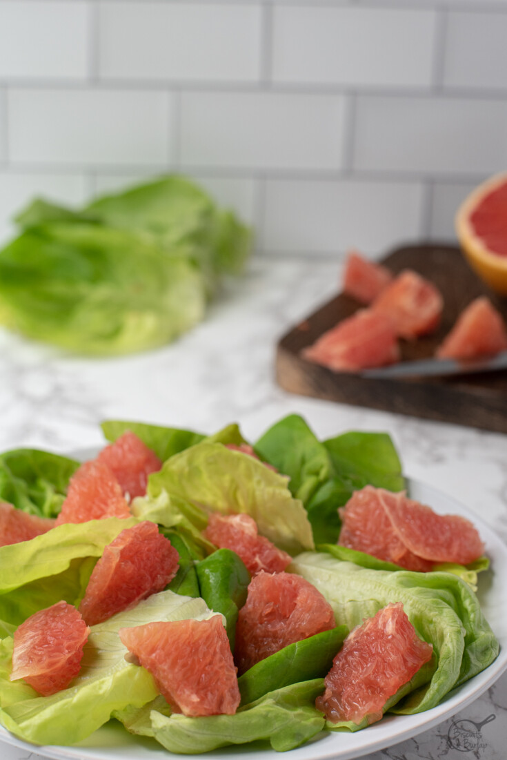 lettuce and grapefruit on plate