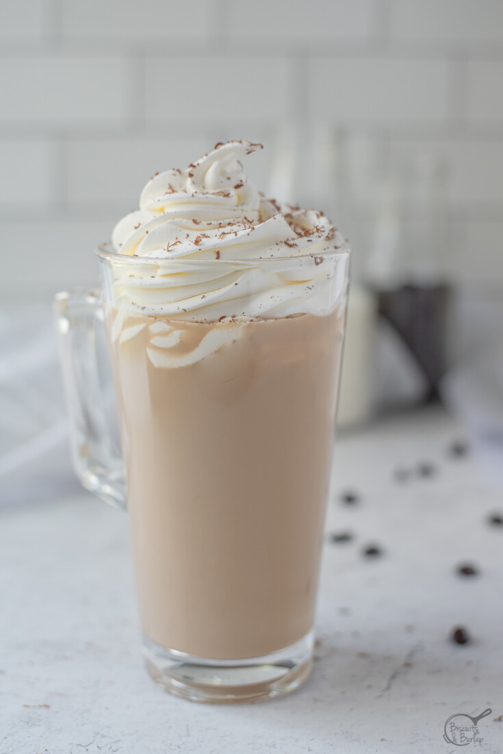 White chocolate mocha topped with whipped cream and chocolate shavings