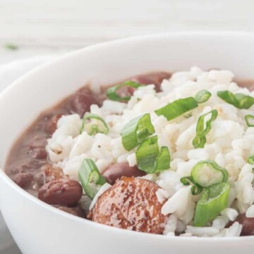 white bowl with andouille sausage, rice and beans.