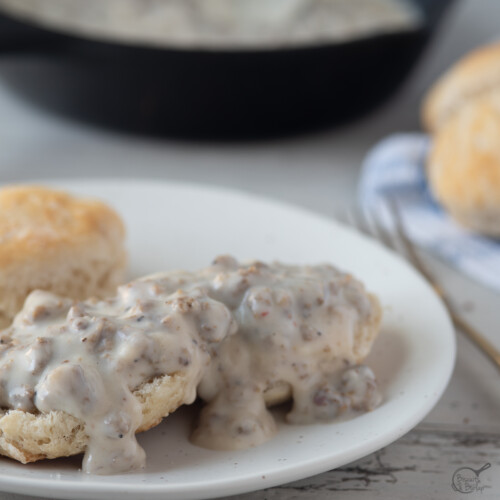 split biscuit covered with sausage gravy