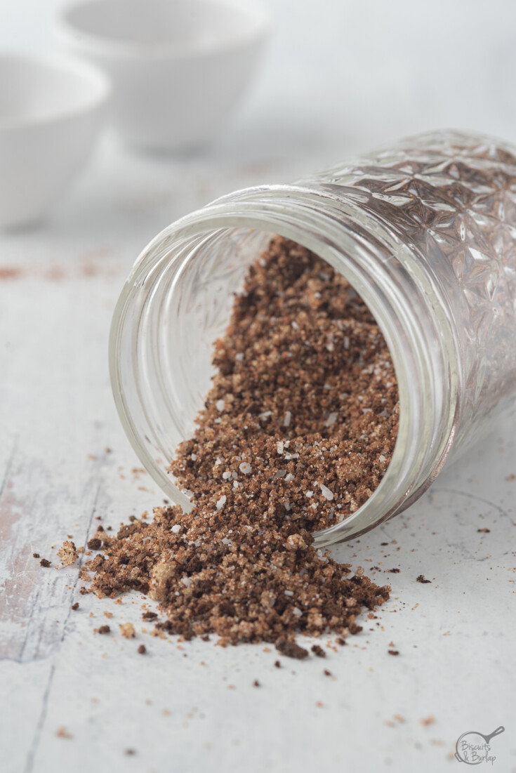 coffee rub mixture for pork spilling out of jar.