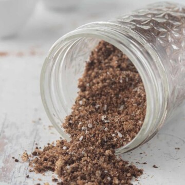coffee rub mixture for pork spilling out of jar.
