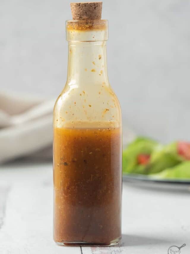 bottle of southwest salad dressing in front of salad.