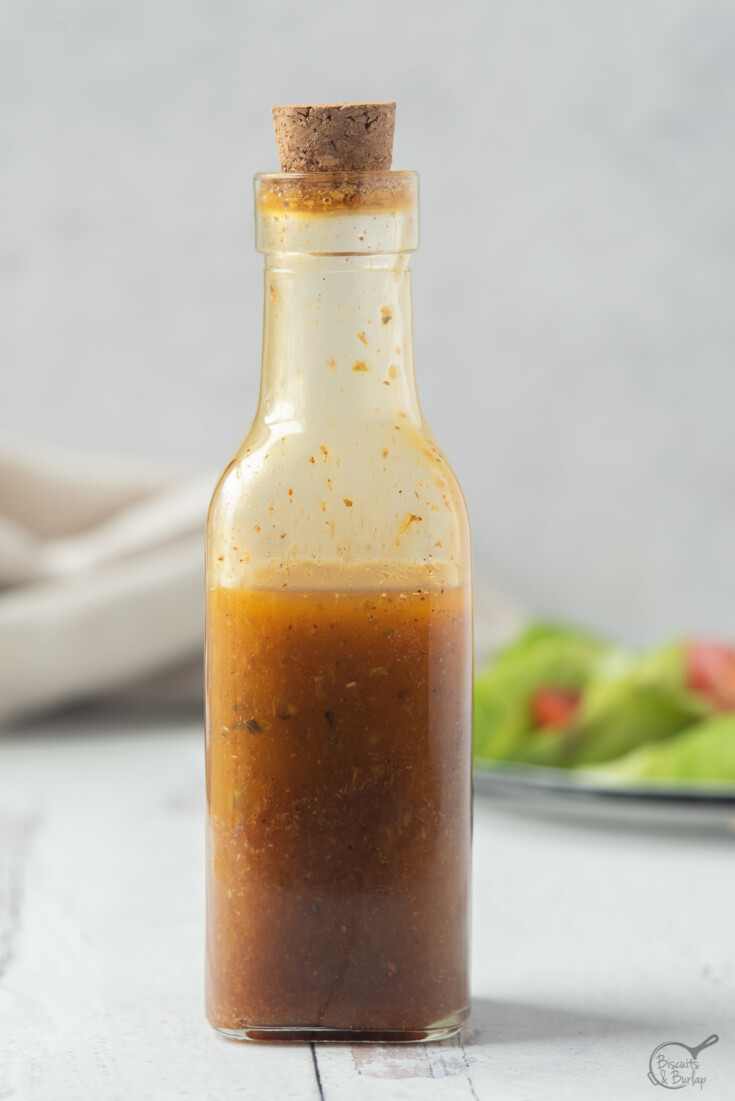 bottle of southwest salad dressing in front of salad. 