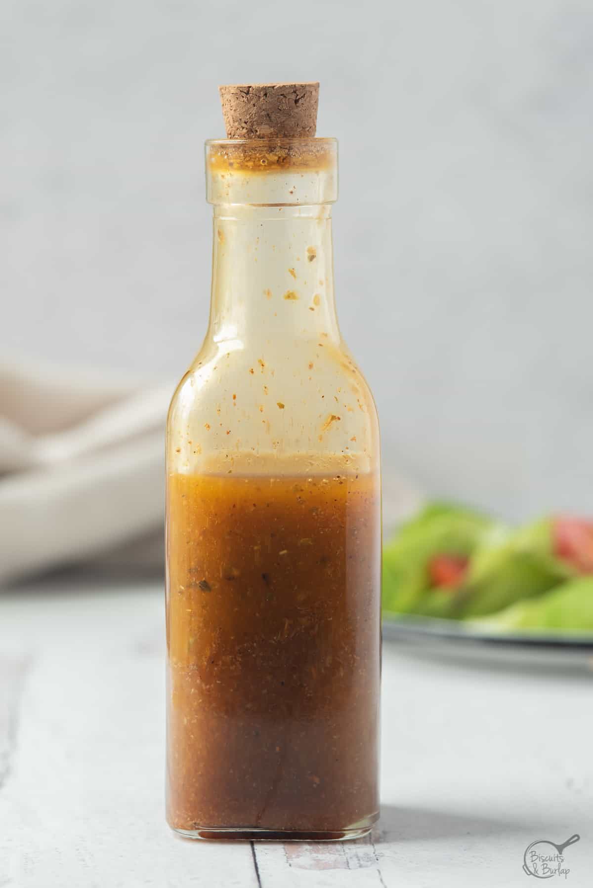 bottle of southwest salad dressing in front of salad.