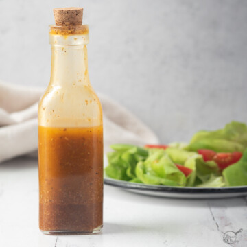 bottle of southwest vinaigrette in front of salad