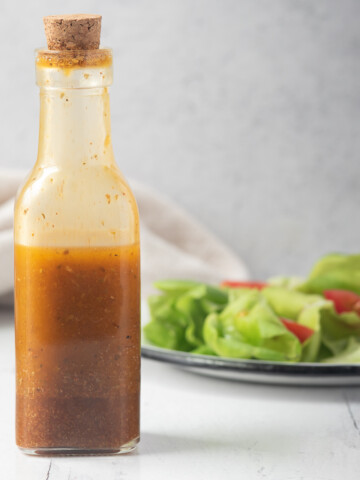 bottle of southwest vinaigrette in front of salad