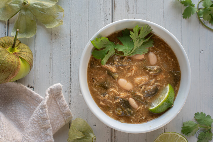 white bowl with green chicken chili.