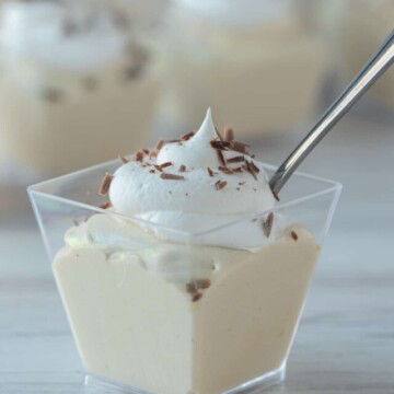 Mudslide Pudding Shot in square glass with a spoon.