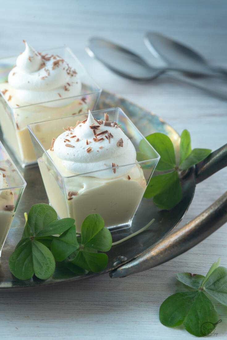 Mudslide Bailey's Pudding Shot in square glass on a silver tray with chocolate shavings on top