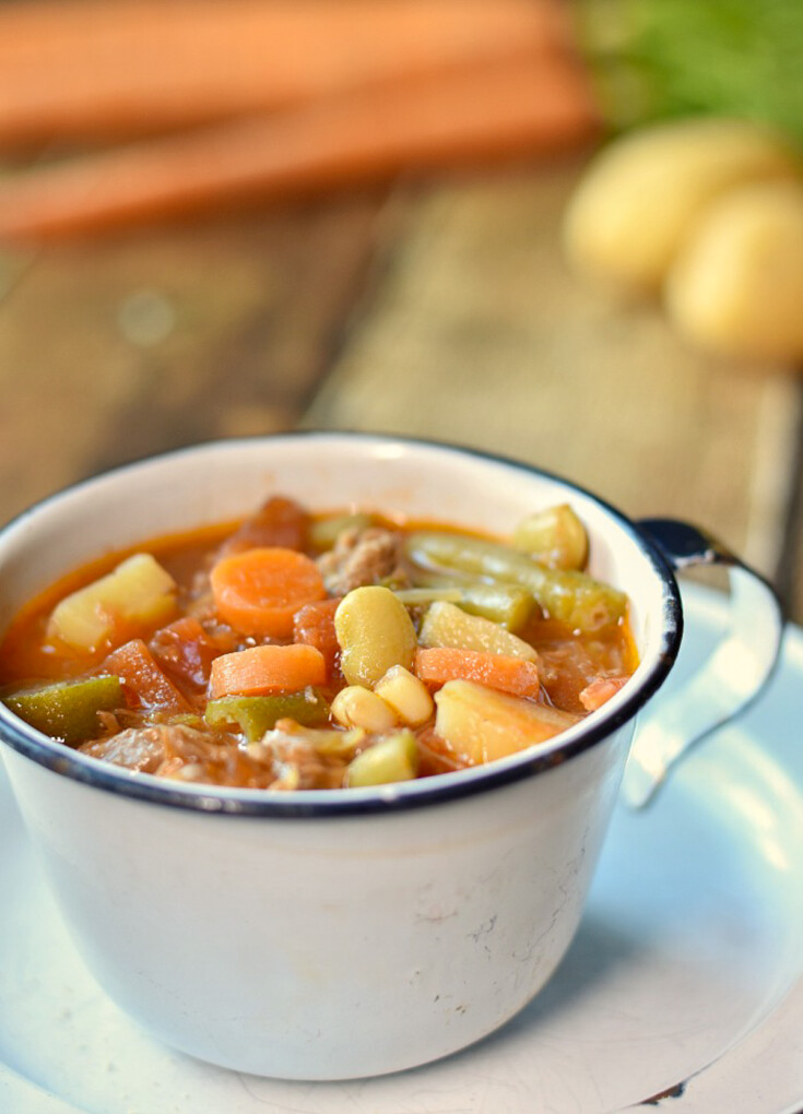 southern style vegetable beef soup in white cup.