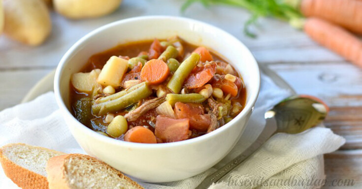 white bowl filled with southern vegetable beef soup. 