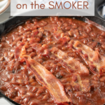 pin image of baked beans on a smoker.