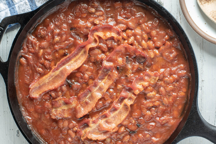overhead image of baked beans on smoker.