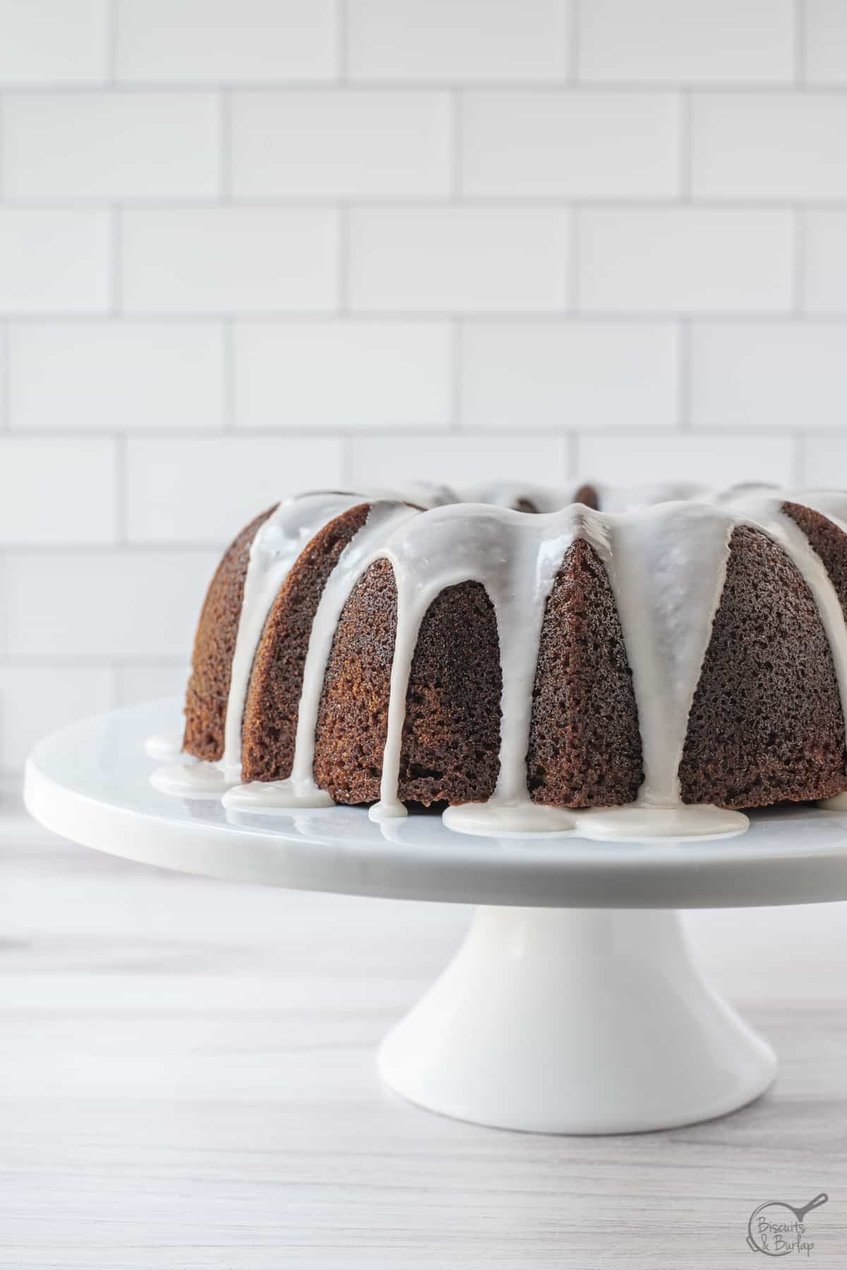 banana cake made in bundt cake pan with white glaze.