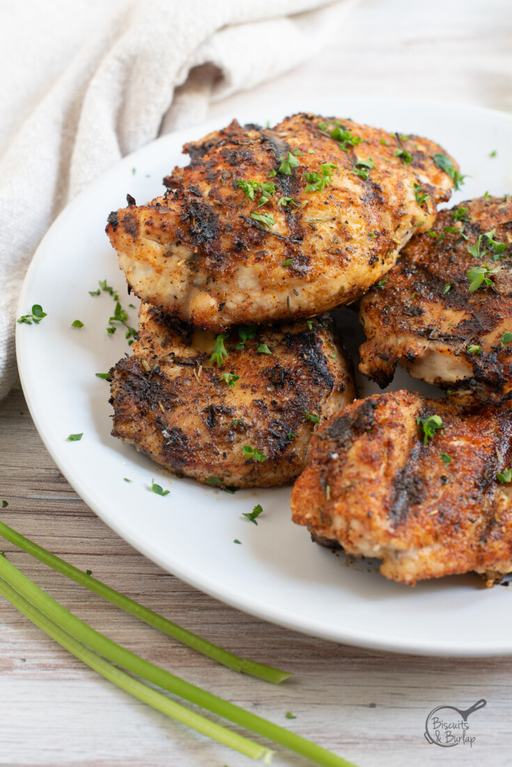 Plate with blackened grilled chicken.