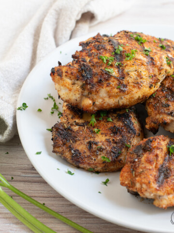 blackened chicken on white plate.