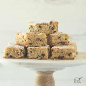 buttermilk bars on small cake stand.