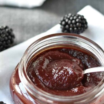 jar of blackberry bbq sauce with spoon.