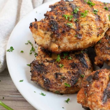 blackened chicken on white plate.