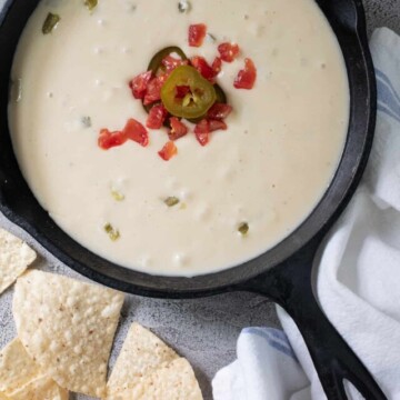 iron skillet of white cheese dip.