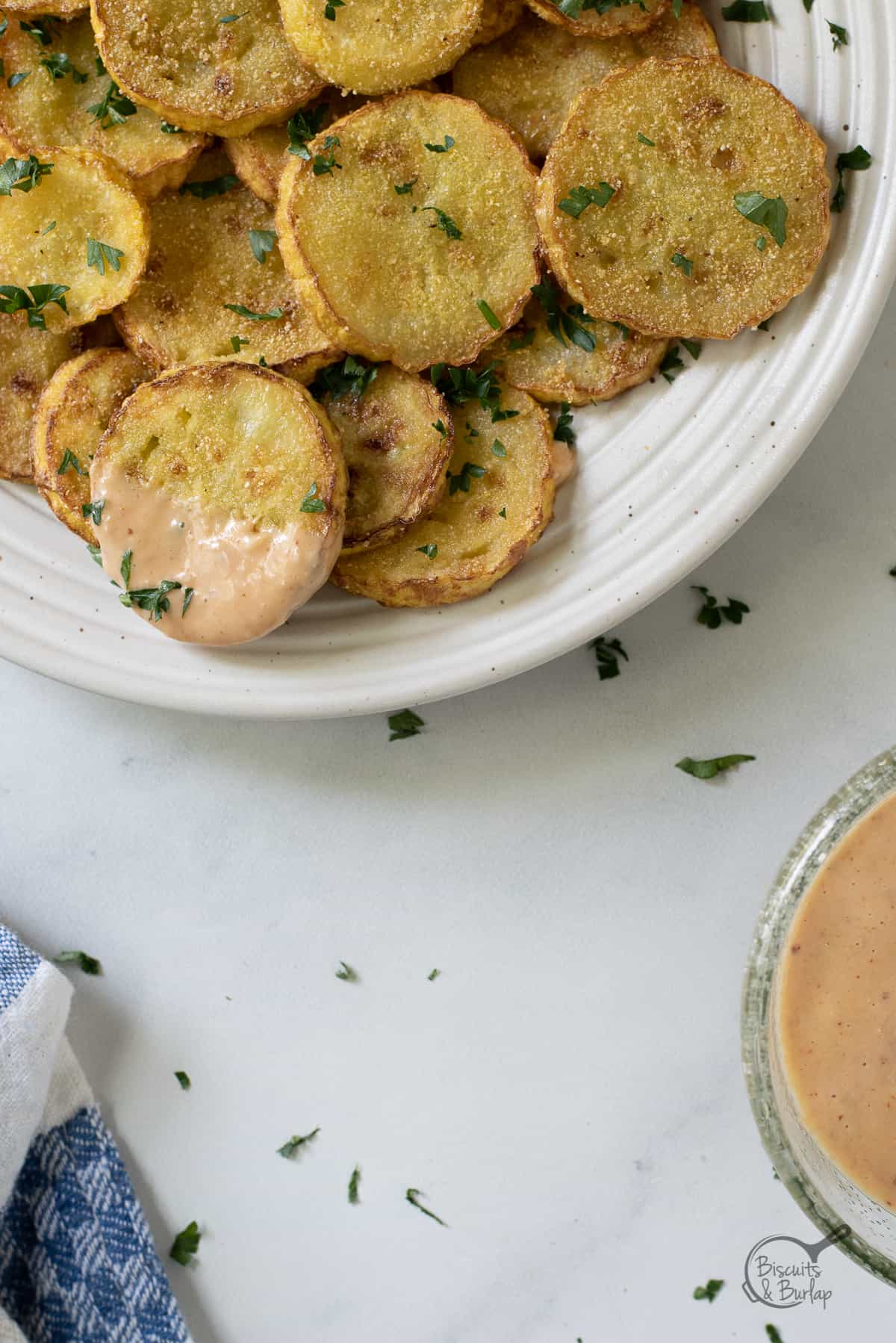 remoulade sauce for dipping with plate of fried squash.