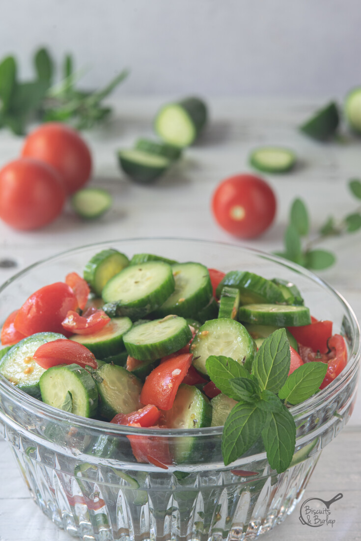 vertical image of Mediterranean cucumber salad in a bowl