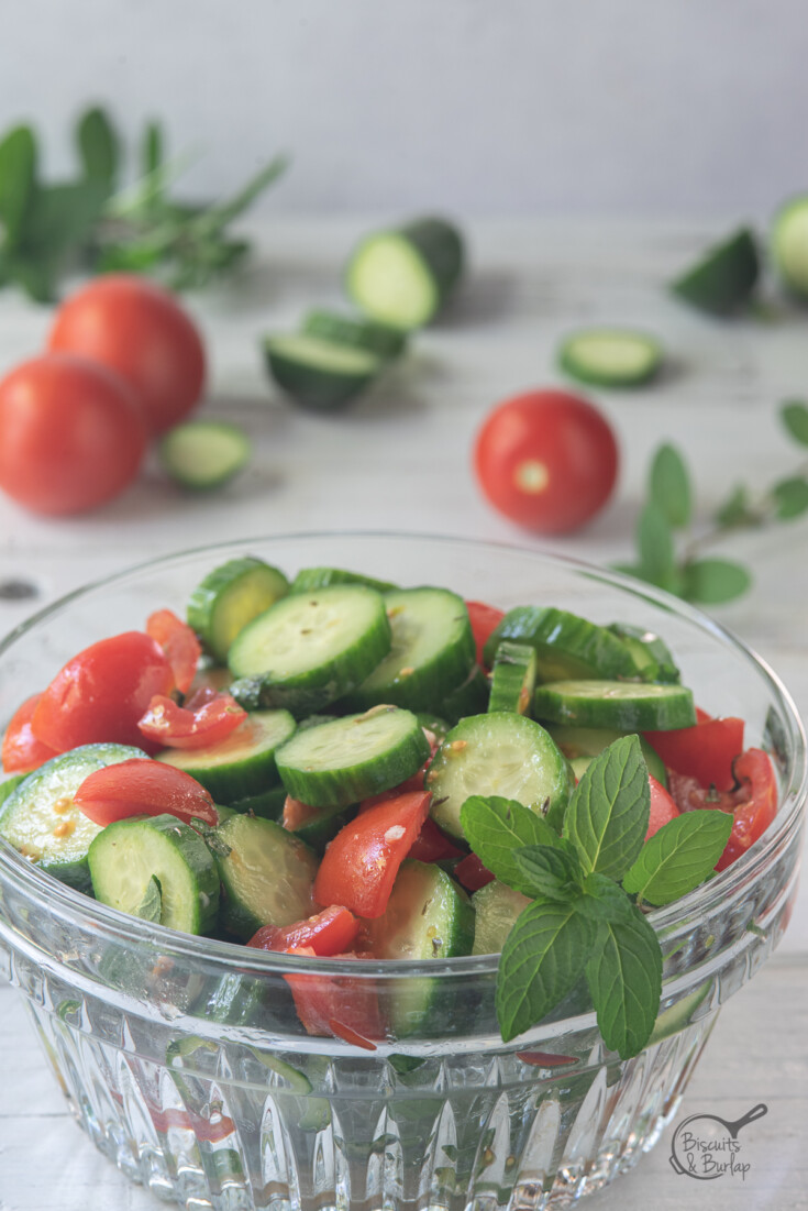 vertical image of Mediterranean cucumber salad in a bowl