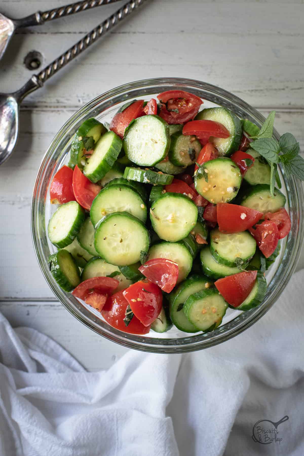 vertical image of Mediterranean cucumber salad in a bowl