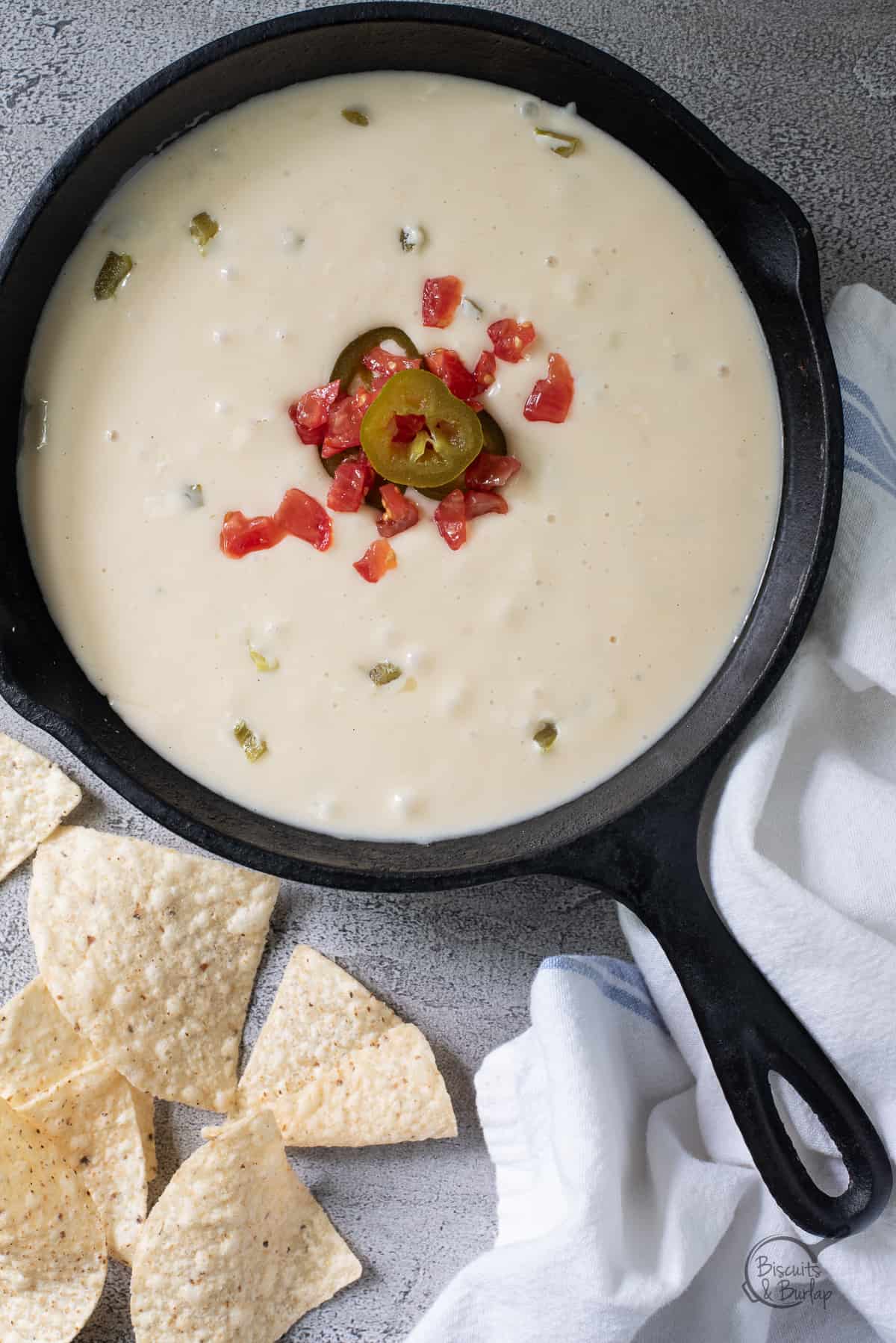 iron skillet of white cheese dip. 