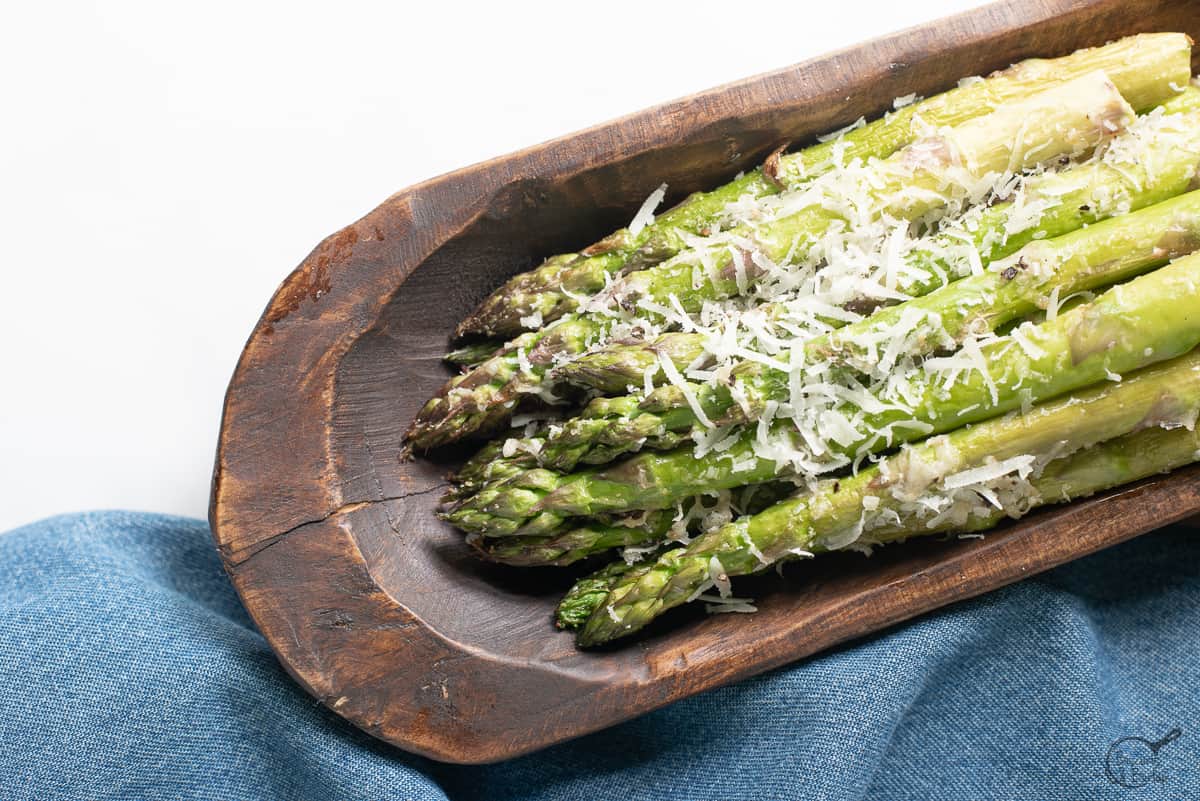 Air Fryer Asparagus Parmesan in wooden dish