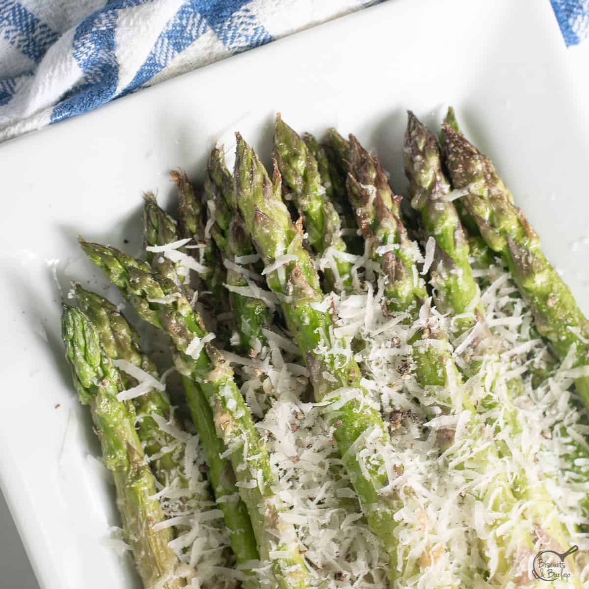 Air Fryer Asparagus Parmesan on white dish