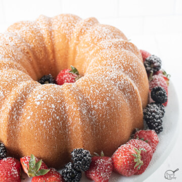 overhead of cream cheese pound cake with berries.