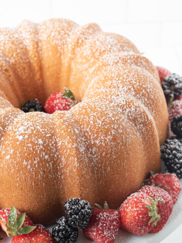 overhead of cream cheese pound cake with berries.