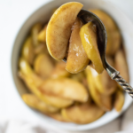 pin image of close up spoonful of fried apples