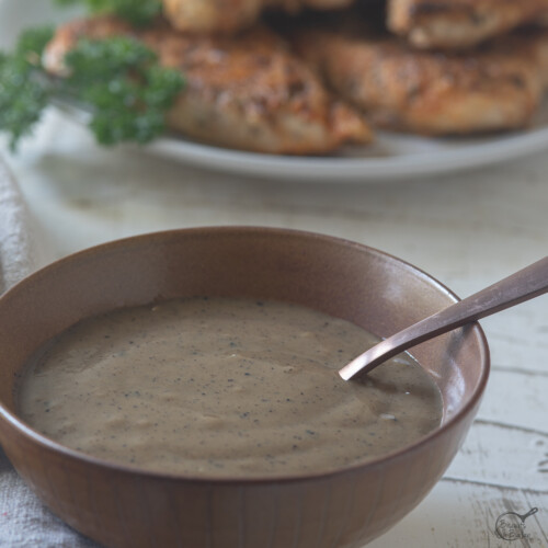 square image of cajun gravy with spoon