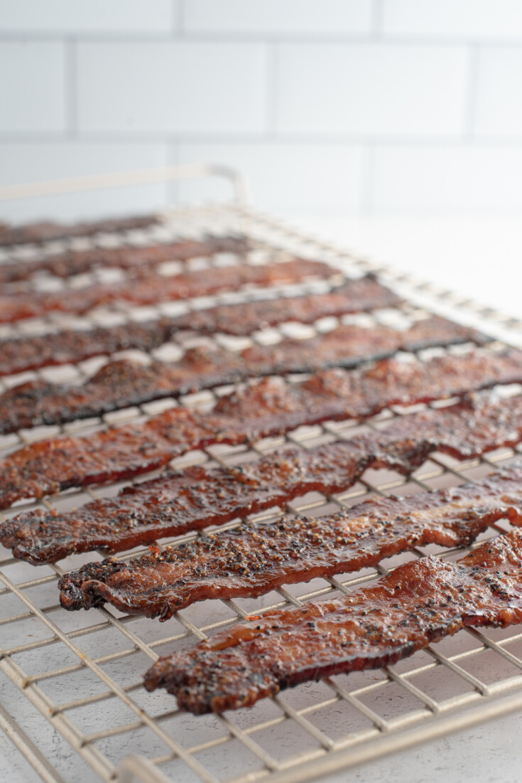 strips of candied bacon on rack.