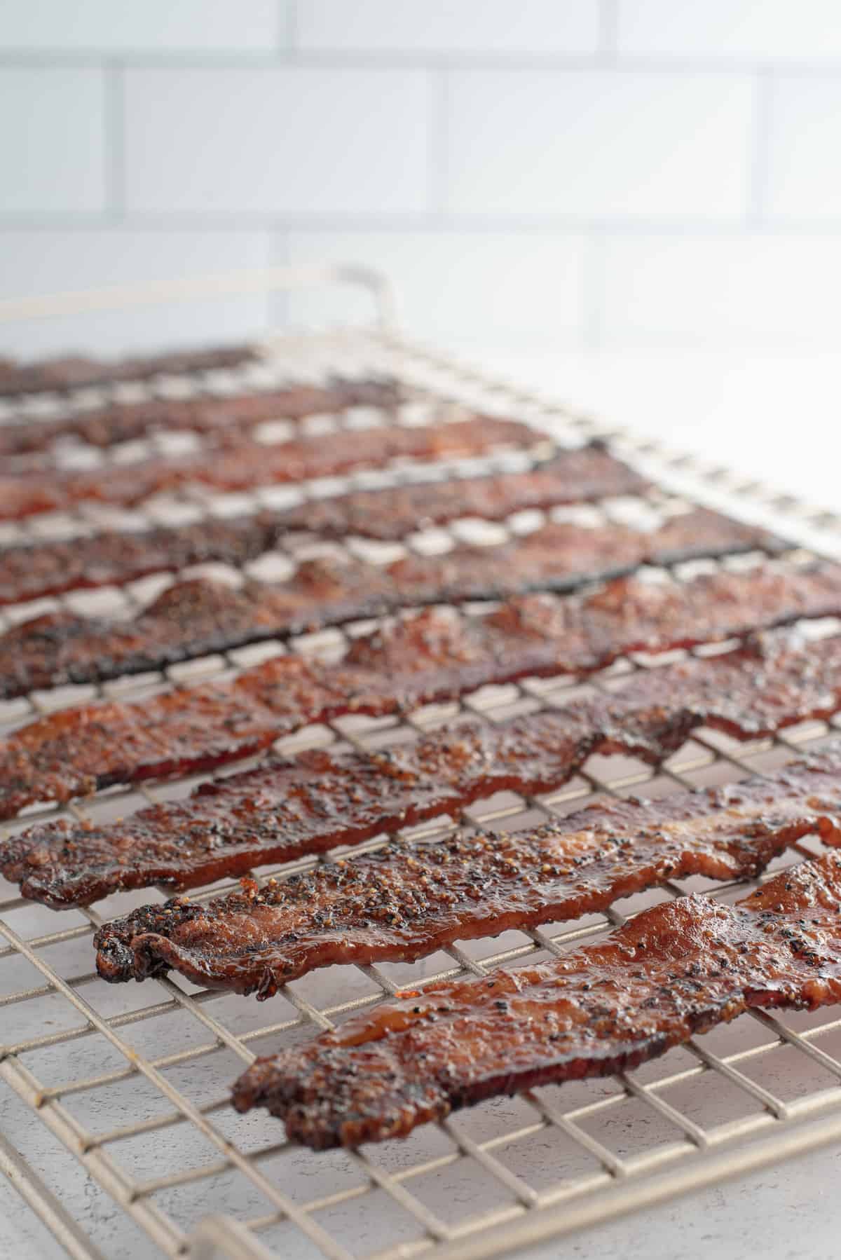 strips of candied bacon on rack.