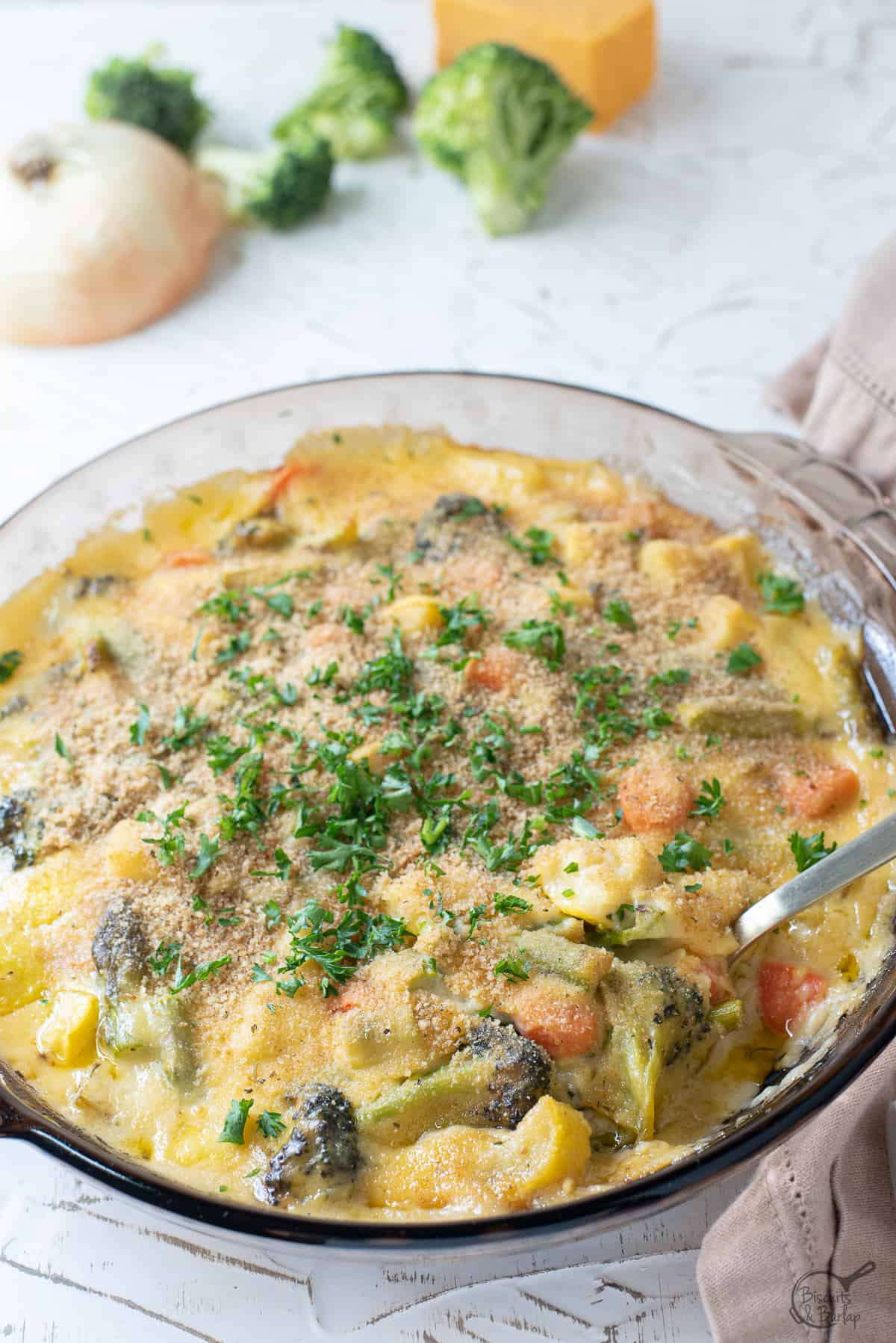 au gratin vegetables with spoon.