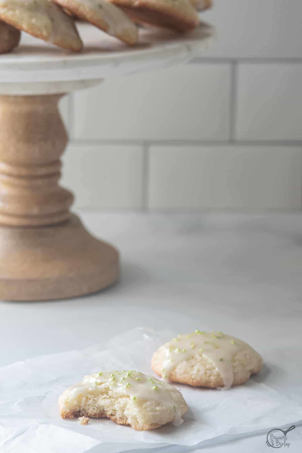 key lime cookie with bite out and more behind.