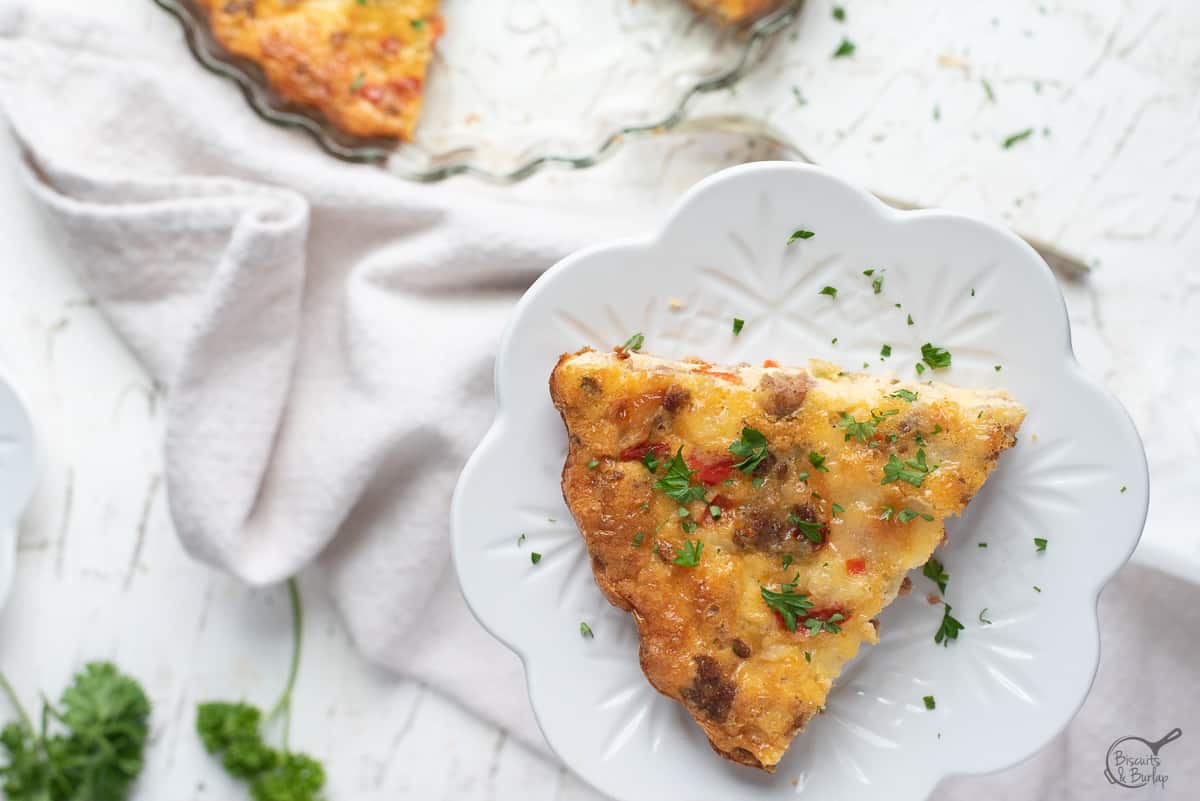 Crustless breakfast quiche slice on white background