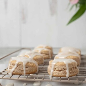 square image of cinnamon biscuits on rack.