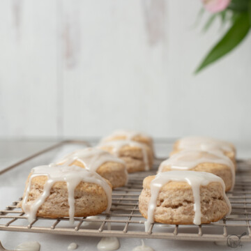 square image of cinnamon biscuits on rack.