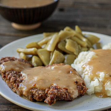 square image of country fried steak plate.