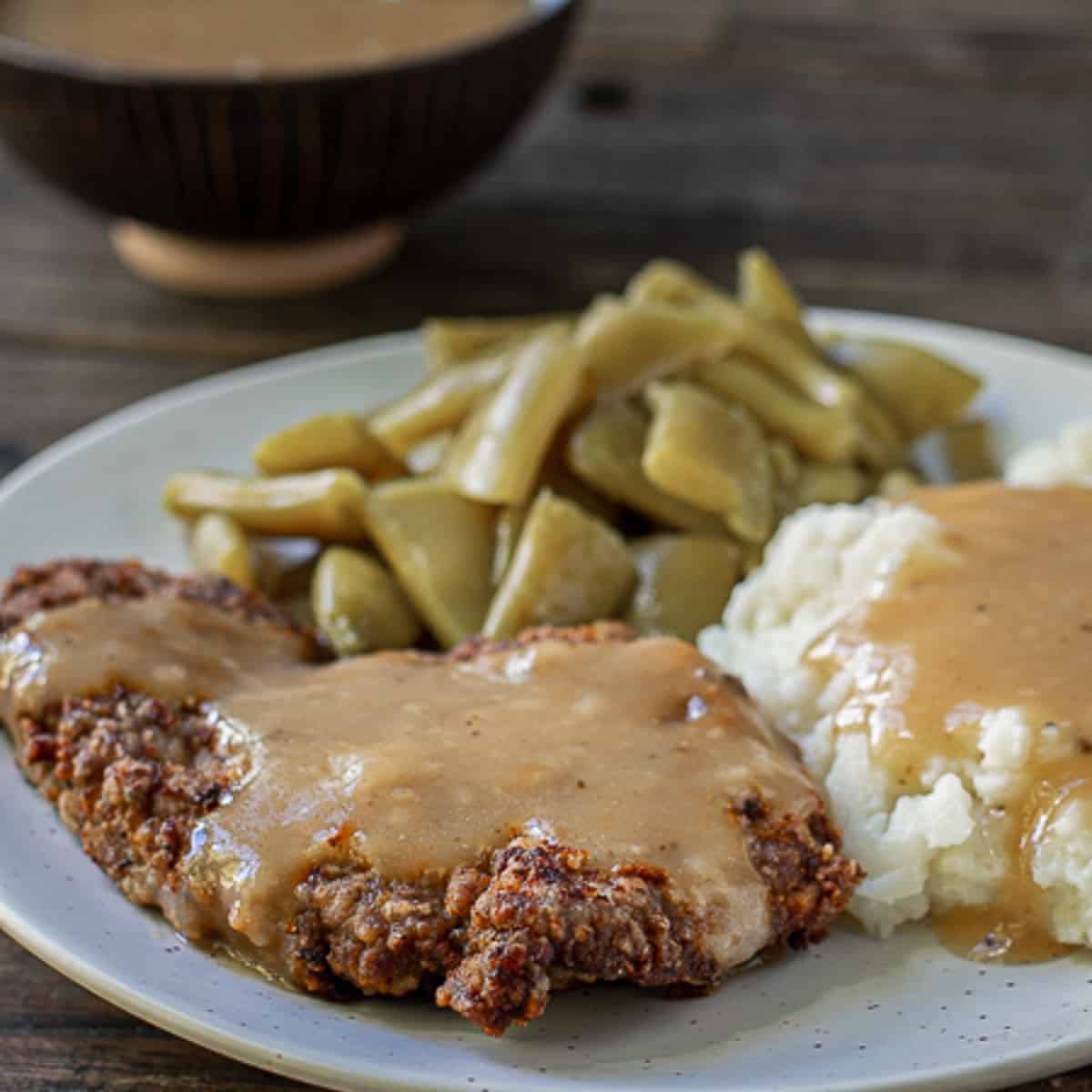 square image of country fried steak plate.