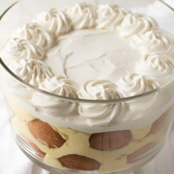 Banana pudding with fancy whipped cream on top.